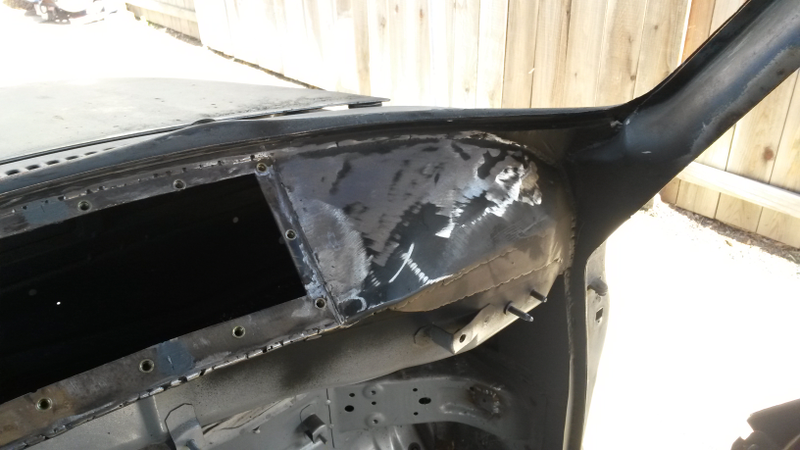 The front dashboard area and A-pillar from the inside. “Lots of shaping and hammering here,” Nelson said. “The center hole is for accessing the cowl vents and wiper system. There are three plates that bolt over it.”
